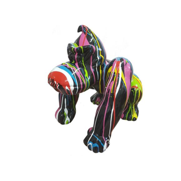 Abstract decorative sculpture designed as a gloss black colored cartoon gorilla in colorful stripes 70cm