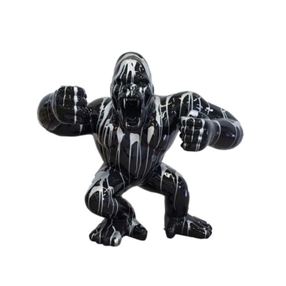 Decorative sculpture designed as a gloss full black colored shouting gorilla in white patterns 120x40cm