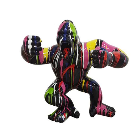 Decorative sculpture designed as a gloss full black colored shouting gorilla in colorful stripes120x40cm