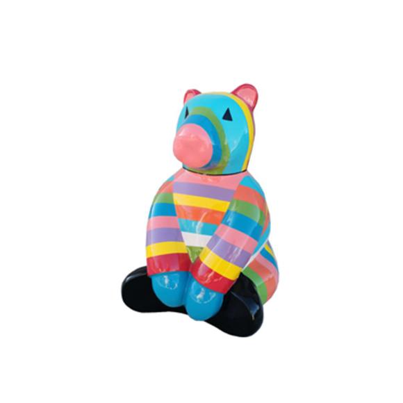 Decorative sculpture designed as a gloss sitting teddy bear in light colorful stripes 85x116 cm