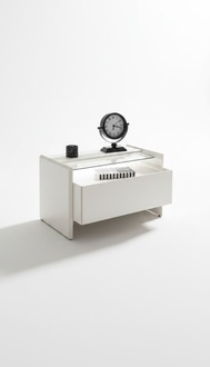 A bedside table with stylish design enhances the room in the bedroom.