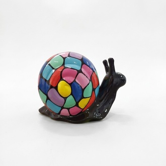 Abstract decorative sculpture designed as a black snail with a colorful mosaic shell