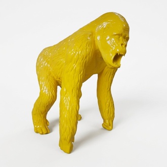 Abstract decorative sculpture designed as a gloss full yellow colored gorilla 130cm