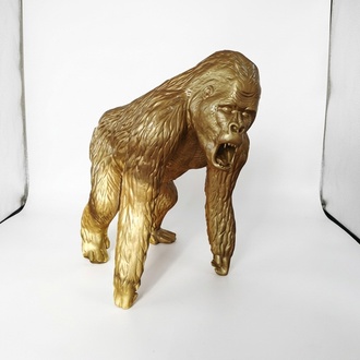 Abstract decorative sculpture designed as a gloss full golden colored gorilla 130cm