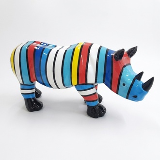 Abstract decorative sculpture designed as gloss standing rhino with colorful stripes in blue tones 35x75cm