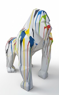 Abstract decorative sculpture designed as a white colored geometric gorilla with colorful stripes 128cm