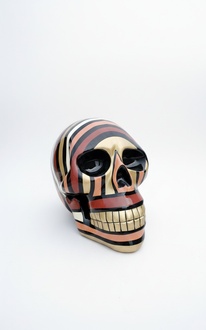 Abstract decorative sculpture designed as a gloss colored in dark red black tones skull figure 58cm