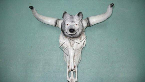 Decorative sculpture designed as cow skull with a wolf head 55cm height