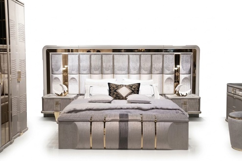 Bedroom set made of wood in beige with bed, nightstands, and bench.