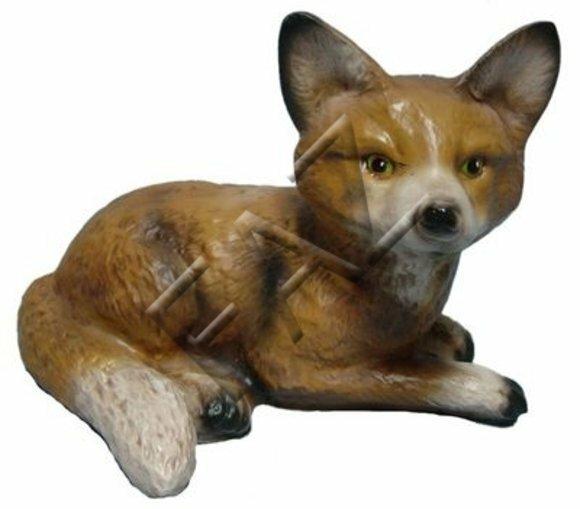 Decorative sculpture designed as light brown colored motley lying fox cub with green eyes 22x30cm