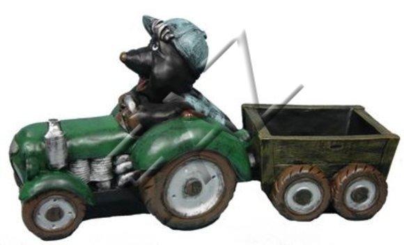 Decorative sculpture designed as black colored mole miner on a tractor with a carriage
