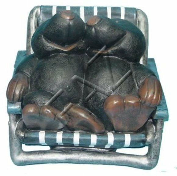 Decorative figure of two black colored moles resting on a chaise longue 56x6cm C289