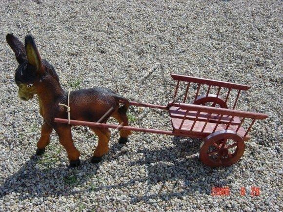 Decorative sculpture designed as brown colored foal with simple wooden carriage figure 80x135cm