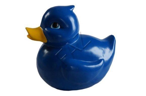 Blue colored decorative sculpture of duck figure with a yellow beak