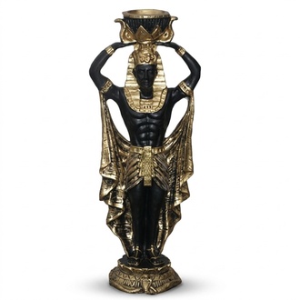Candlestick designed as a decorative black gold colored ancient egyptian figure 37cm