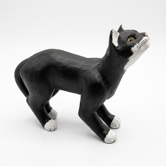 Motley black white colored decorative cat sculpture with green eyes 42x60cm