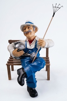 Decorative sculpture designed as gardener on a bench with watering can & rake 57cm B431