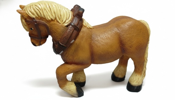 Decorative sculpture designed as light brown colored blond pony