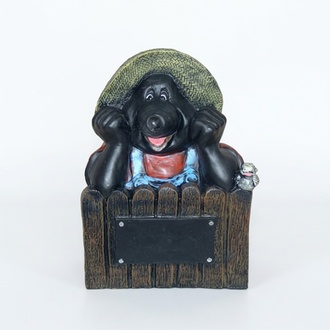 Decorative sculpture designed as a colorful happy mole on a fence 50 cm