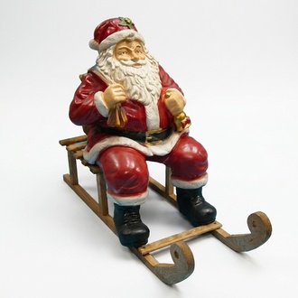 Christmas decorative figure designed as santa claus on a wooden sled 65x80cm