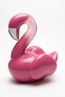 Decorative sculpture designed as gloss pink colored sitting flamingo figure