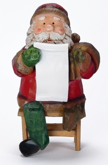 Christmas decorative figure designed as sitting santa claus with a merry christmas tablet 35cm