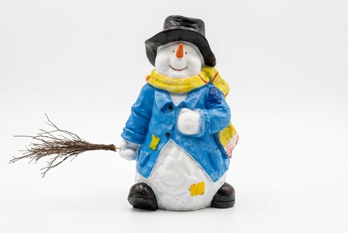 Decorative sculpture designed as a snowman in a blue jacket with a broom 75x50x40cm