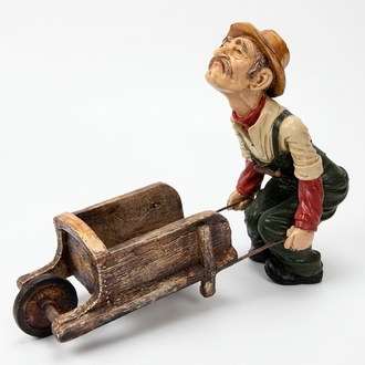 Deco gloss figure designed as an old gardener carrying a wheelbarrow 57x80cm