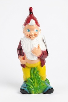 Decor figure designed as a gloss colorful standing dwarf on a grass 150cm