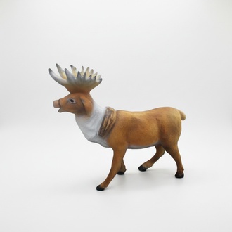 Decorative sculpture designed as a motley light brown white colored standing reindeer 74x83cm