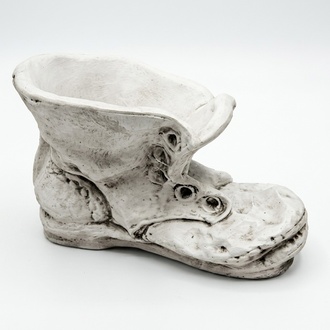 Deco figure of a flower pot designed as an worn out white boot 35x52cm