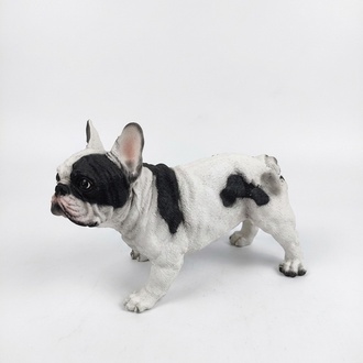 Decorative sculpture designed as a motley white black colored stanning dog 30x45cm