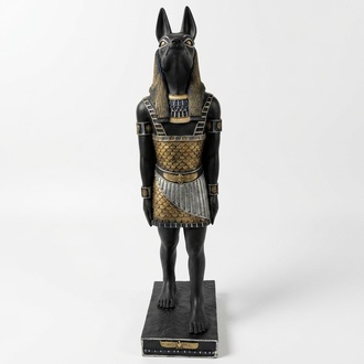 Ancient egyptian decorative sculpture designed as a black colored anubis in a golden suit 100cm