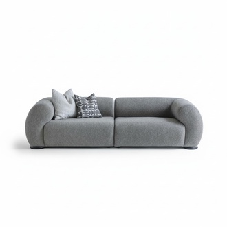 Elegant gray 4-seater sofa made of fabric with a modern design.