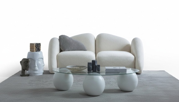 Elegant white 3-seater sofa made of fabric in a modern design.
