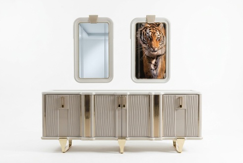 Elegant white wooden sideboard with mirror in modern design.