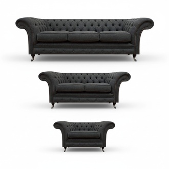 Exclusive black upholstered Chesterfield three-seater luxurious armchair.