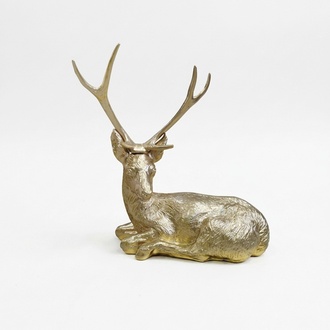 Decorative sculpture designed as a full light golden colored resting deer 75x75cm