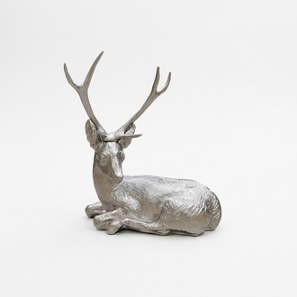 Decorative sculpture designed as a full light silver colored resting deer 75x75cm