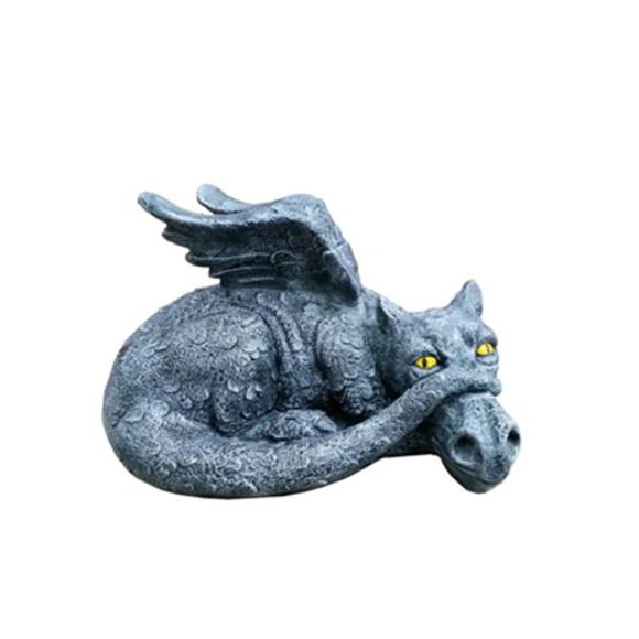 Decorative sculpture designed as a dark grey lying dragon with yellow eyes 53x52cm G13