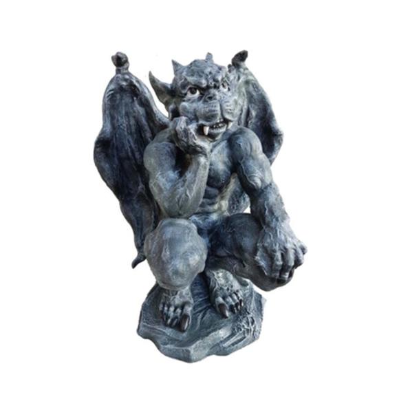 Decorative sculpture designed as a dark grey colored massive bored goblin 57cm