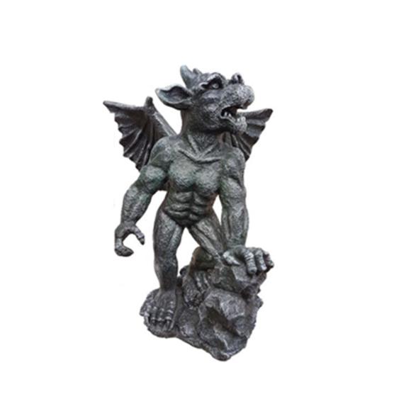 Decorative sculpture designed as a dark grey colored dragon goblin on a stone 54cm G23