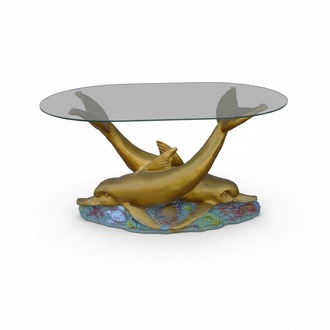 Oval glass coffee table with decorative two golden colored dolphins 47cm