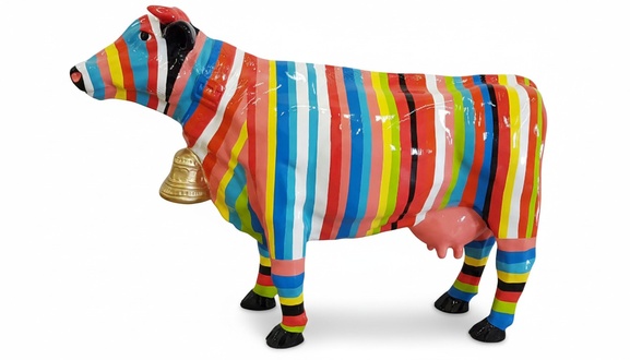 Massive decorative abstract sculpture in modern style designed as a gloss cow with colorful stripes & a bell