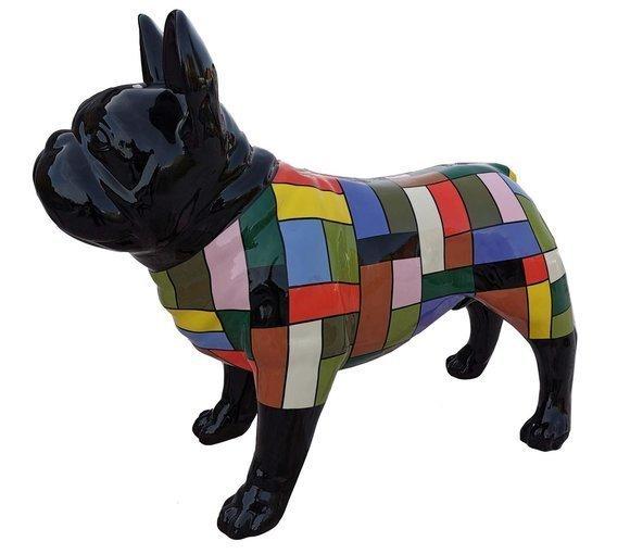 Decorative abstract sculpture designed as black gloss colored standing dog in colorful suit 75x100cm