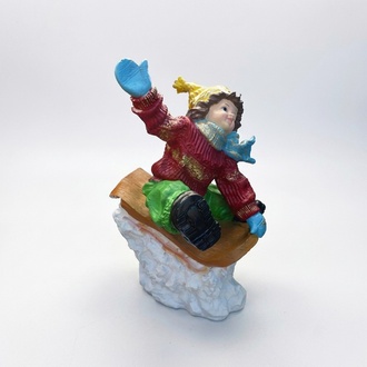 Decorative sculpture designed as a christmas figure boy in a sled 51cm