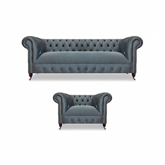 Light gray upholstered Chesterfield living room three-seater armchair.