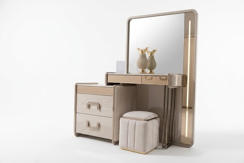 Modern beige makeup table with mirror and wooden stool.