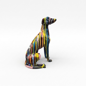 Decorative abstract sculpture designed as a black colored sitting dog in colorful stripes 80cm