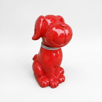 Decorative gloss sculpture designed as a full red colored sitting cartoon dog with a brilliant collar 45cm